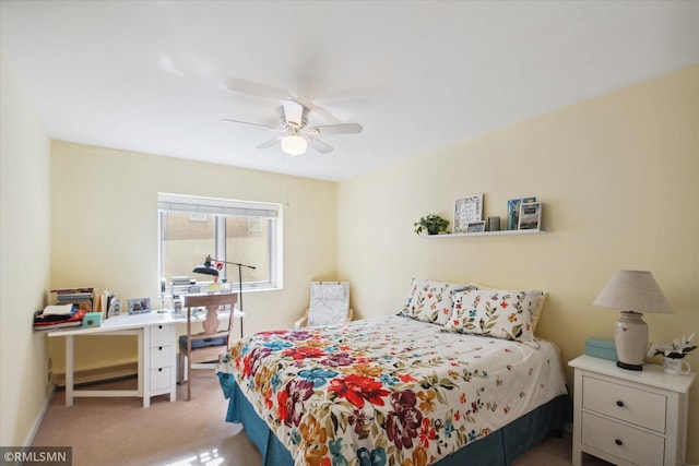 bedroom with light colored carpet and ceiling fan