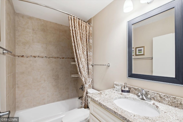 full bathroom with vanity, shower / bath combination with curtain, and toilet