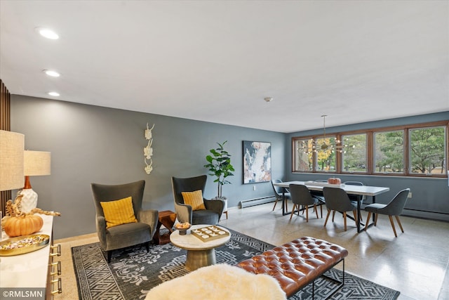 living room with a baseboard heating unit and an inviting chandelier