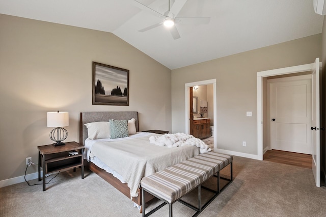 carpeted bedroom with lofted ceiling, ensuite bath, and ceiling fan