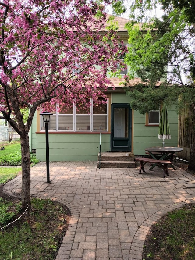 back of house with a patio