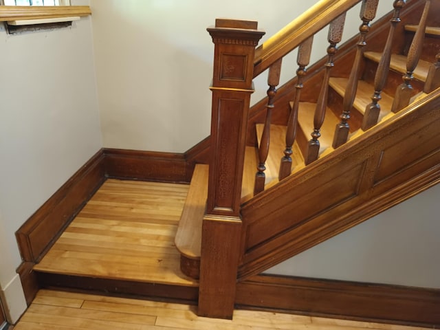 staircase featuring wood finished floors
