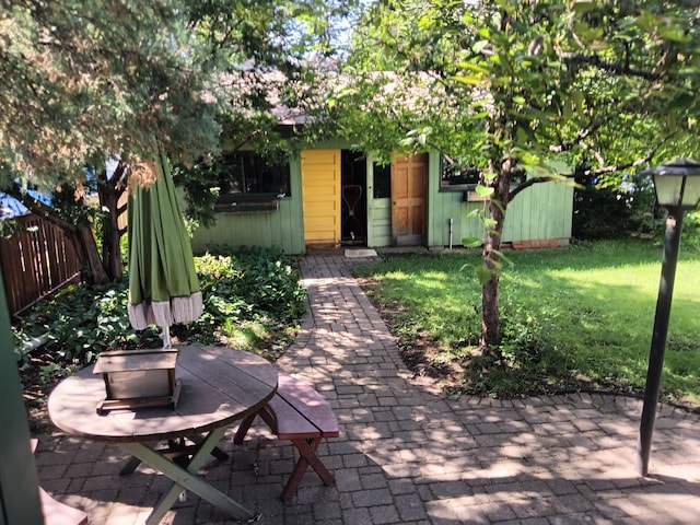 view of patio / terrace featuring fence