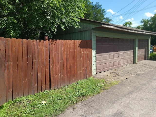 detached garage with fence