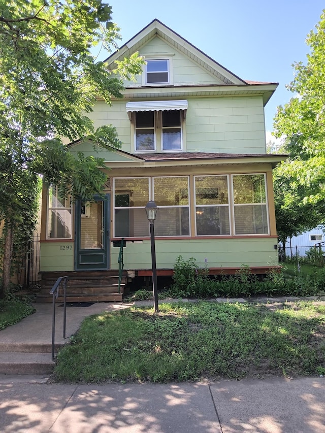 view of front facade featuring a sunroom