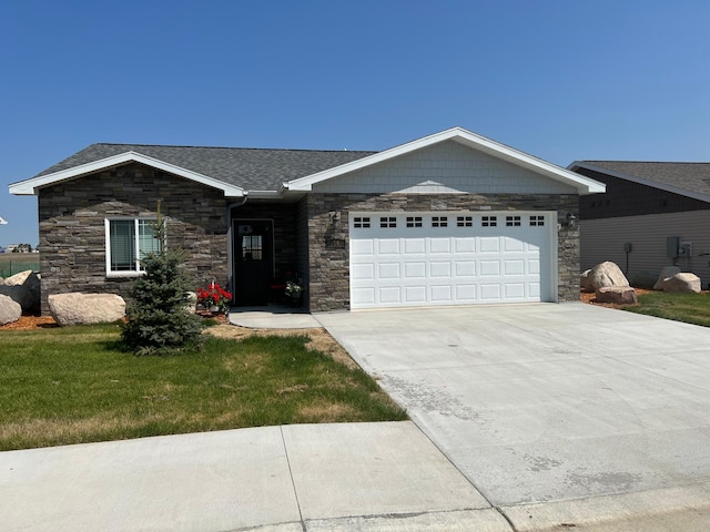 ranch-style home with a front lawn and a garage