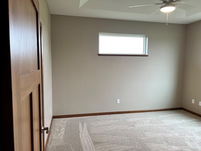 empty room with light carpet and ceiling fan