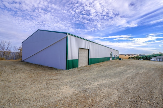 view of pole building with driveway