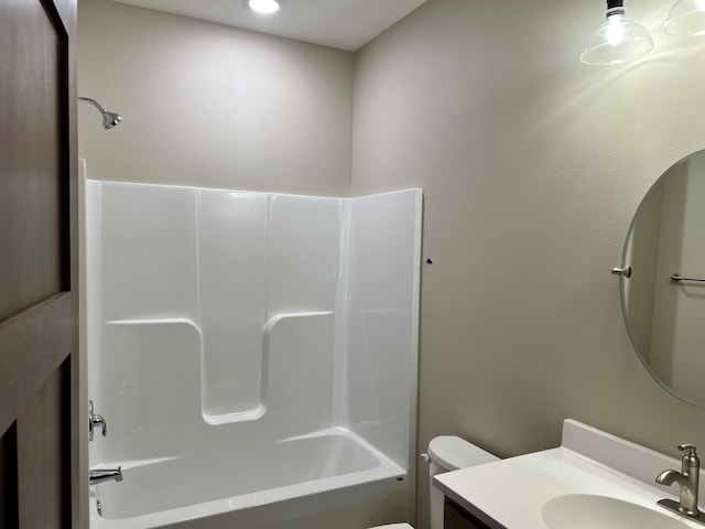 full bathroom with bathing tub / shower combination, vanity, and toilet