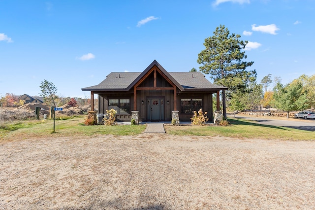 view of front of house featuring a porch and a shingled roof