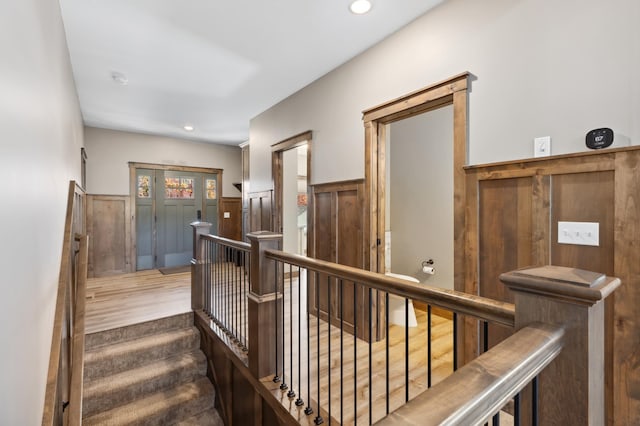 stairs with hardwood / wood-style flooring