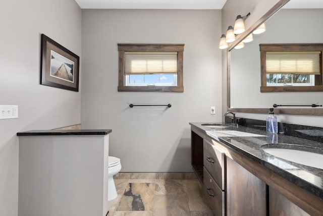 bathroom with toilet and vanity