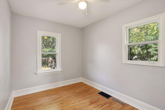 empty room featuring ceiling fan and wood-type flooring