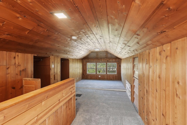 bonus room featuring dark colored carpet, lofted ceiling, wooden walls, and wooden ceiling