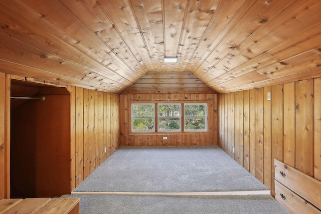 bonus room with carpet flooring, wood walls, wood ceiling, and lofted ceiling