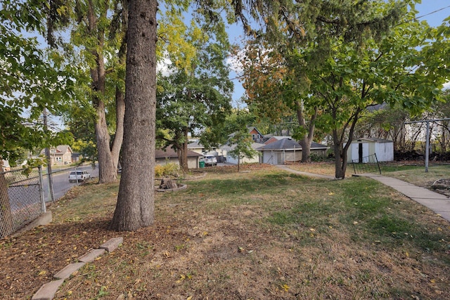 view of yard with a storage unit