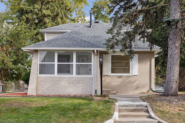 bungalow with a front lawn