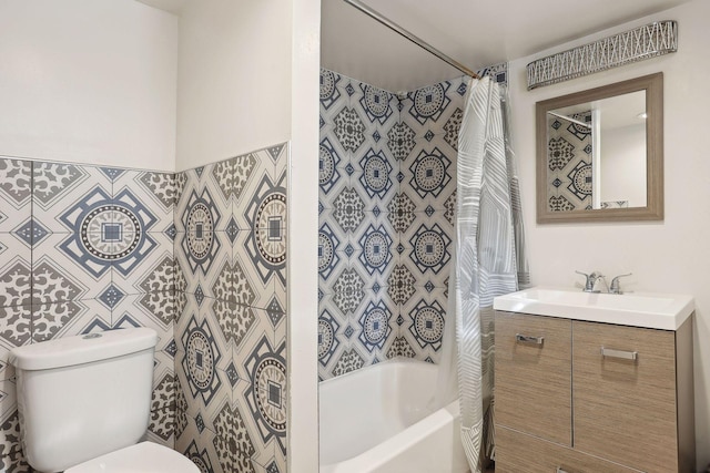 full bathroom featuring shower / bath combo, vanity, and toilet