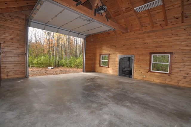 31071 State 34, Akeley Twp, MN 56433 - garage featuring wood walls and a wood stove