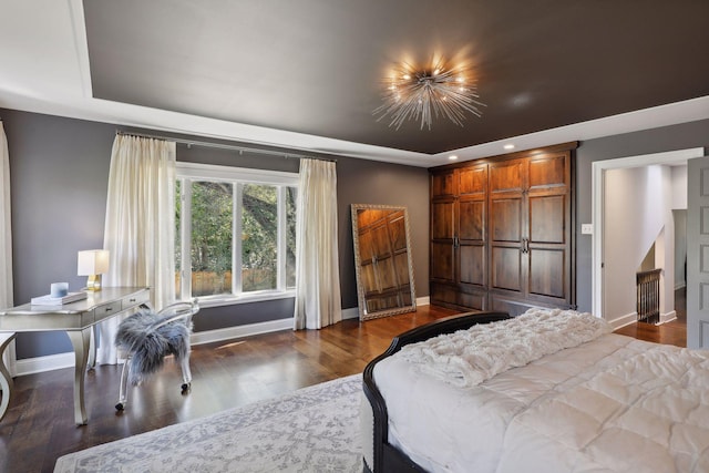 bedroom featuring dark hardwood / wood-style flooring