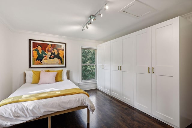 bedroom featuring dark wood-type flooring and ornamental molding