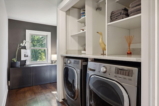 laundry area with dark hardwood / wood-style flooring and separate washer and dryer