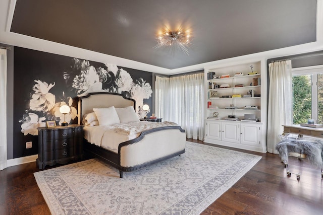 bedroom with dark wood-type flooring