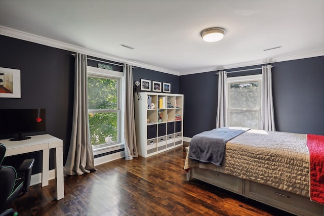 bedroom featuring dark hardwood / wood-style flooring and ornamental molding