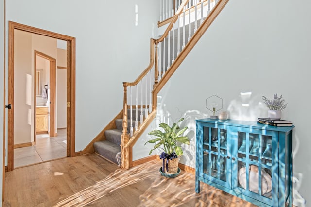 stairway with hardwood / wood-style flooring