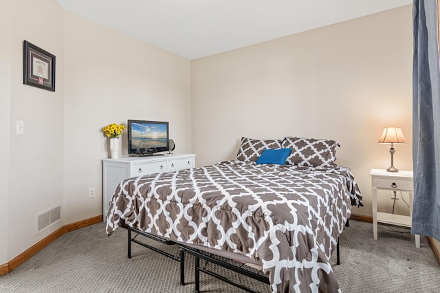 bedroom with light colored carpet