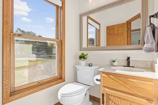 bathroom featuring toilet and vanity