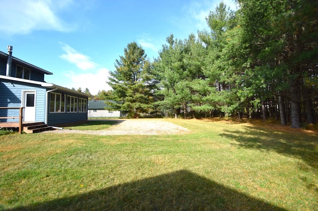 view of yard with a deck