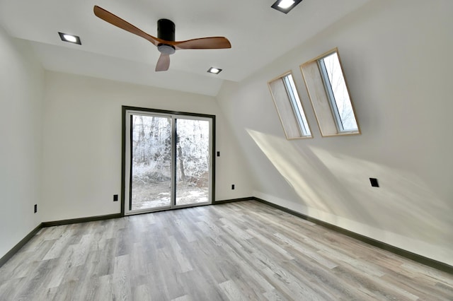 empty room with light hardwood / wood-style floors and ceiling fan