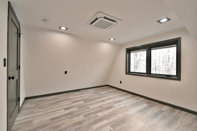 spare room featuring light wood-type flooring