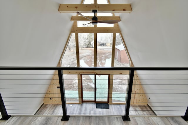 details featuring beam ceiling, hardwood / wood-style floors, and wooden walls