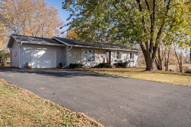 ranch-style home with a garage