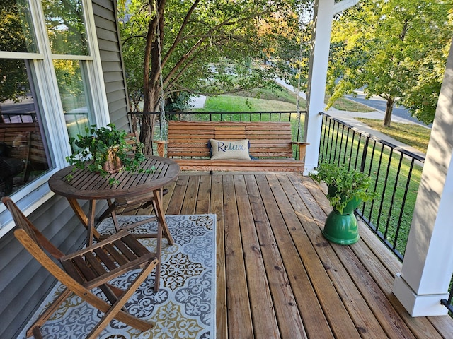 wooden deck with a yard