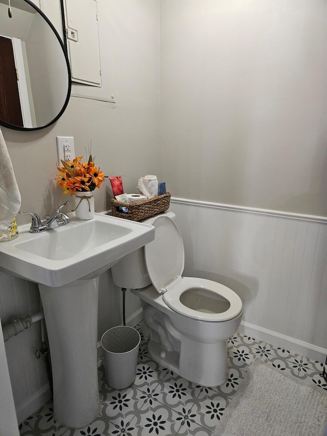 bathroom with tile patterned floors, sink, and toilet