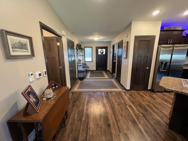 corridor featuring dark hardwood / wood-style floors