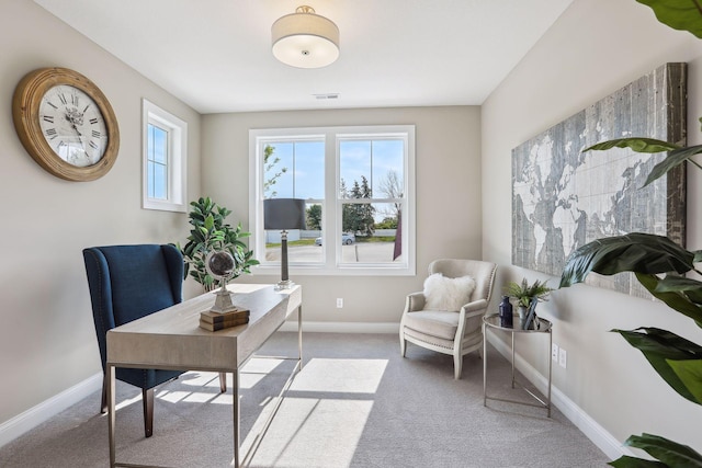 office area with carpet flooring, baseboards, and visible vents