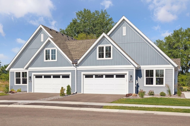 view of front of house featuring concrete driveway, board and batten siding, and a shingled roof