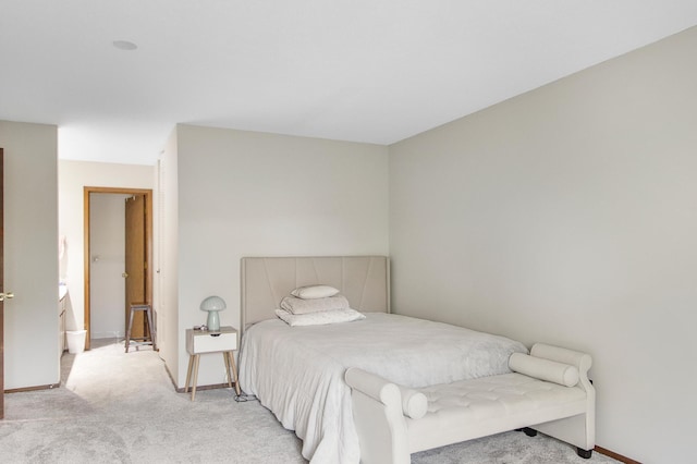 bedroom with light colored carpet