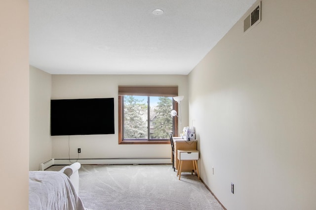 bedroom with light colored carpet and a baseboard heating unit