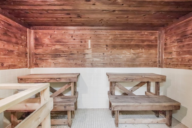 view of sauna / steam room with wood walls and wooden ceiling