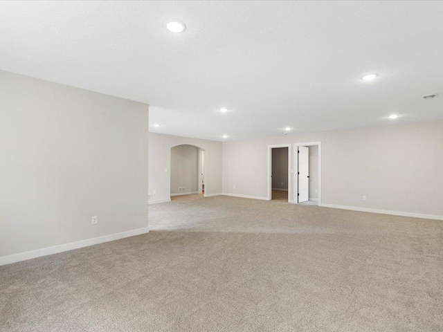 spare room with light colored carpet