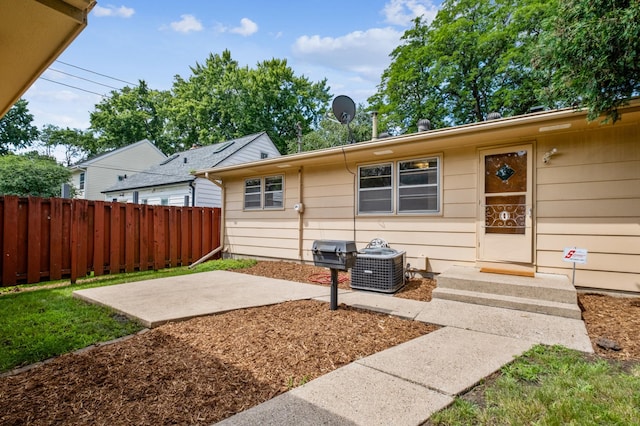 exterior space with cooling unit and a patio area