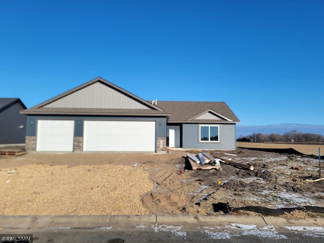 view of front of house with a mountain view and a garage