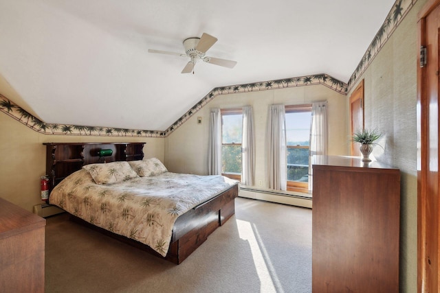 carpeted bedroom with ceiling fan, vaulted ceiling, and baseboard heating