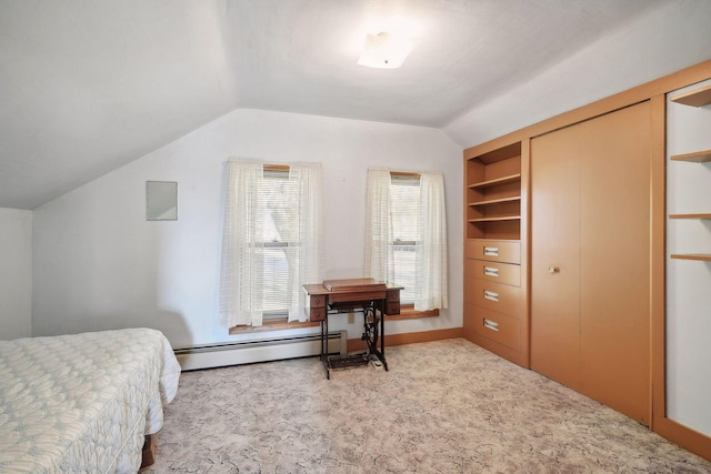 bedroom with baseboard heating, lofted ceiling, light colored carpet, and a closet