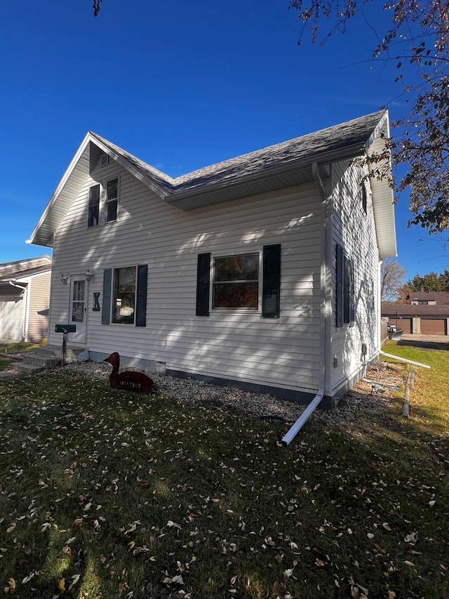 view of home's exterior with a yard